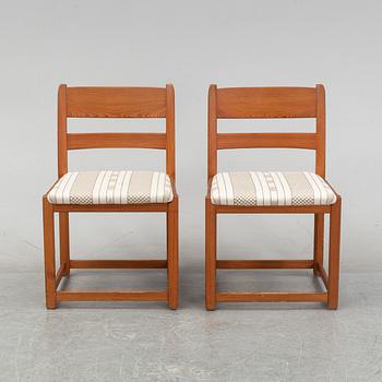 Six chairs by Carl Malmsten and a table by an unknown maker.