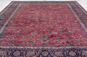 A semi-antique Mashad carpet of Shah Abbas design, c 516 x 360 cm.