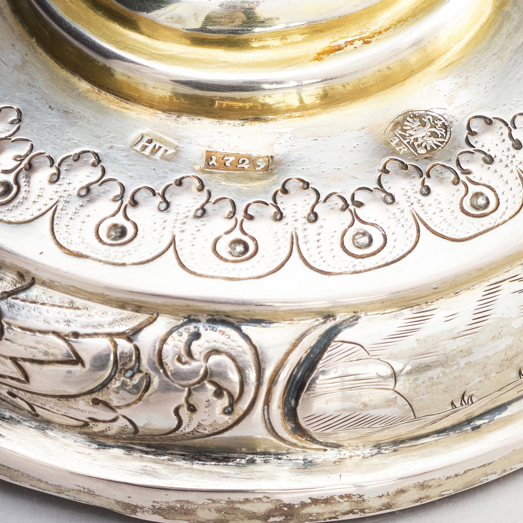 A pair of Russian Baroque parcel-gilt silver cups and covers, mark of Nikifor Timofeev, Moscow 1729.