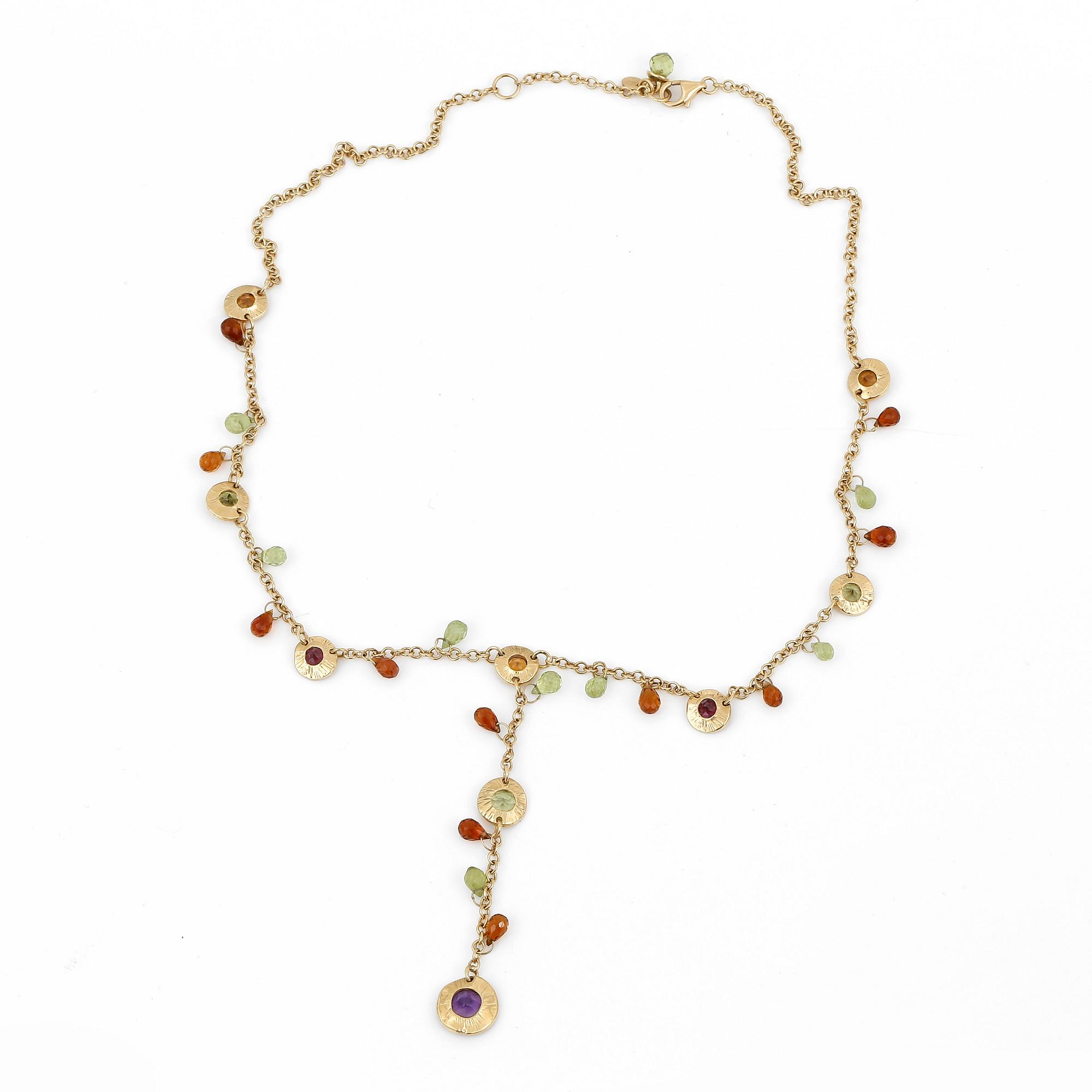 An 18K gold necklace with amethysts, peridotes and citrines.