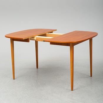 A second half of the 20th Century teak dining table.