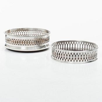 Two English silver coasters, mark of E Edmonds, Birmingham, 1930 and C J Vander Ltd, London 1969.