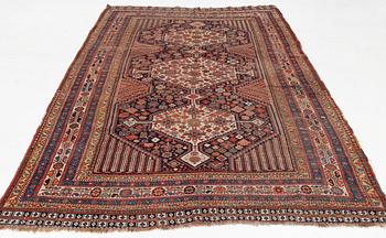 An antique Khamseh carpet, South western Iran, c 352 x 178 cm.