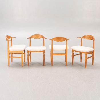 A set of 14 Henning Kjaerulf 1950s oak chairs.