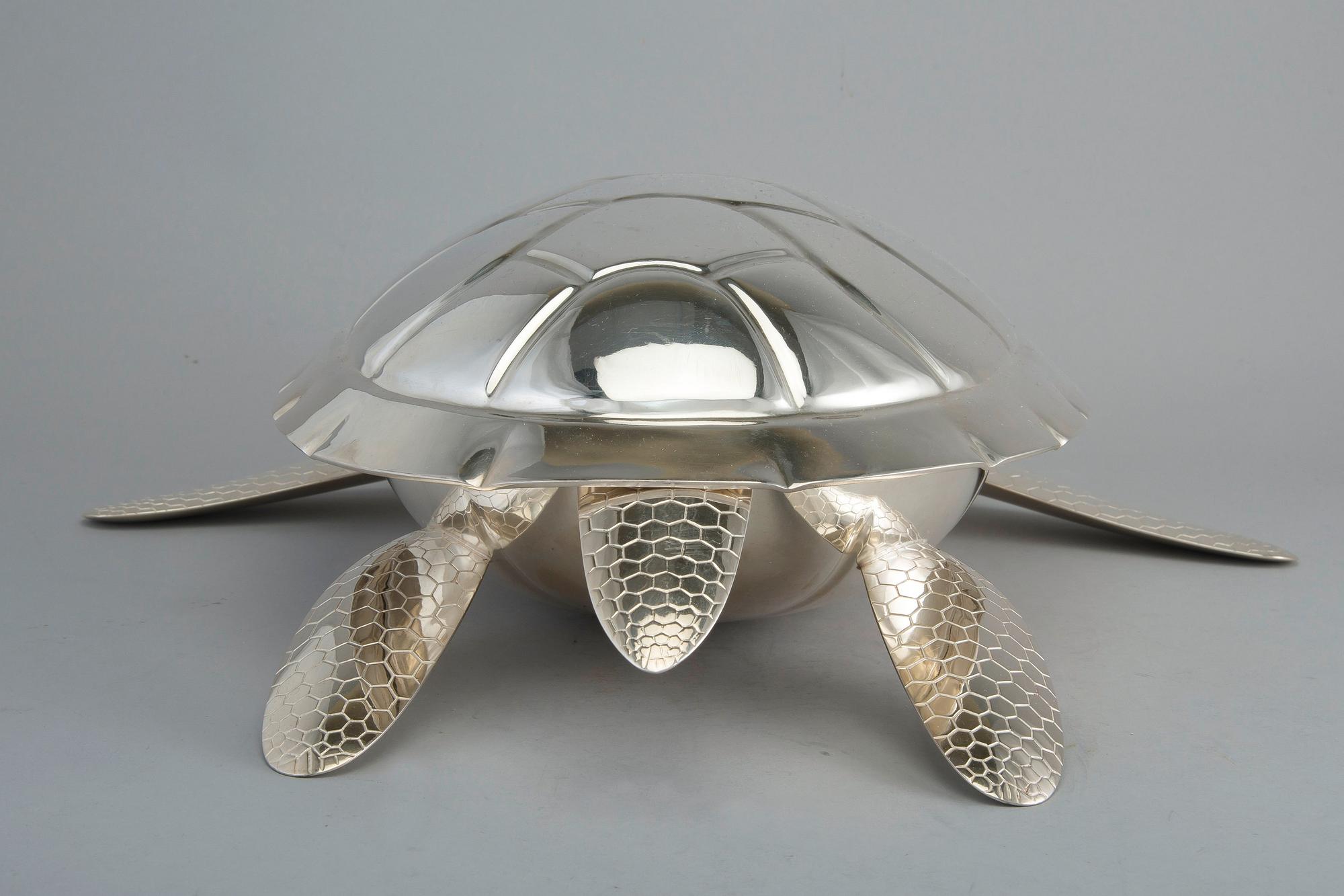 A SOUP TUREEN WITH LADLE, sterling silver, J. A.  Tarkiainen Helsinki 2000. Length 45 cm, weight 2248 g.