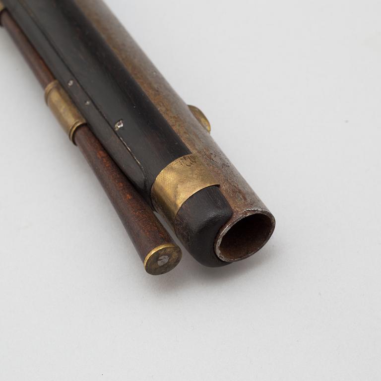 A 18th century flintlock pistol.