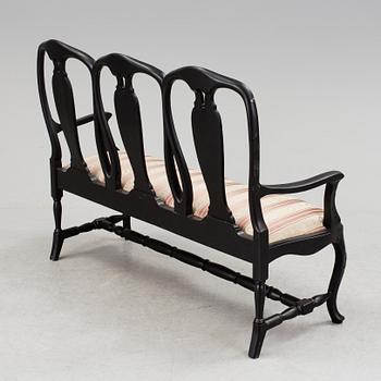 A mid 1900s rococo style sofa.