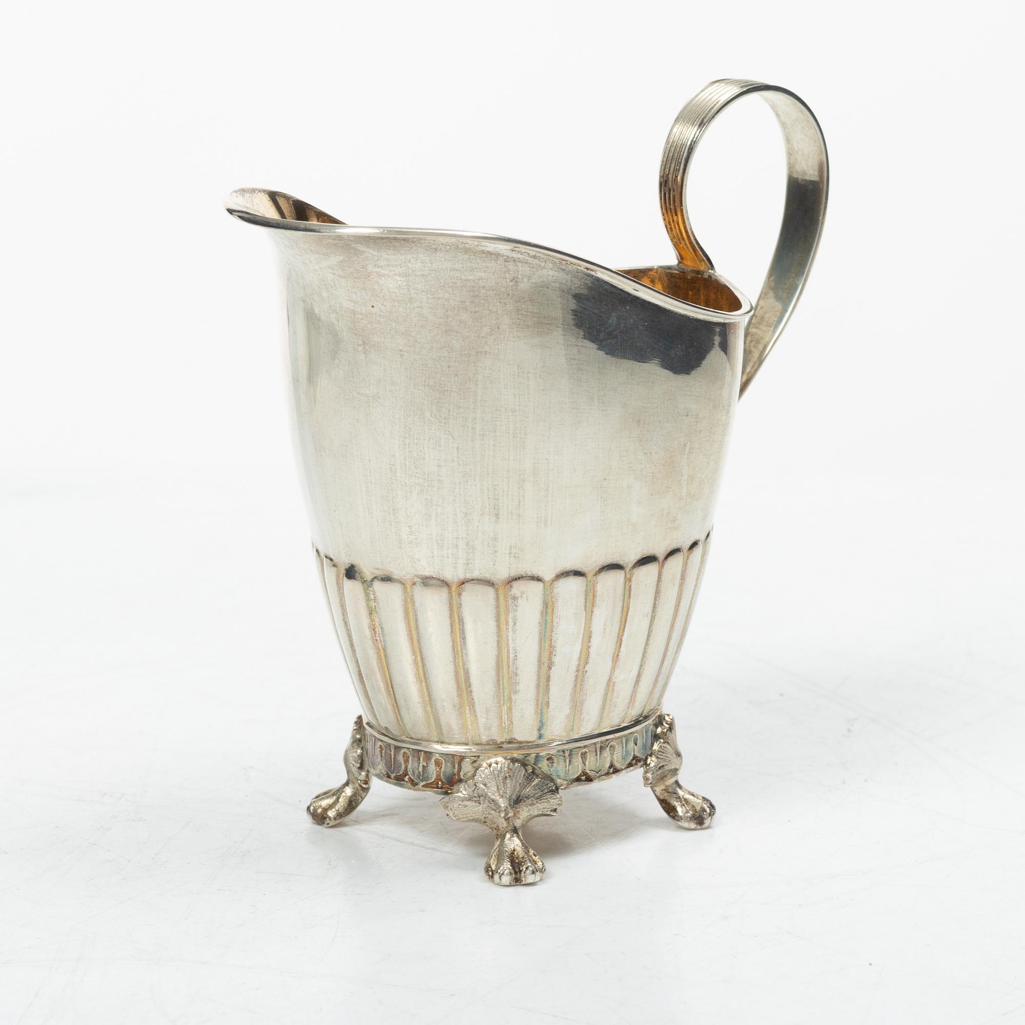 A Swedish silver coffee pot, cream jug and sugar box, Gustavian style, mark of AG Dufva, Stockholm 1911-1912.