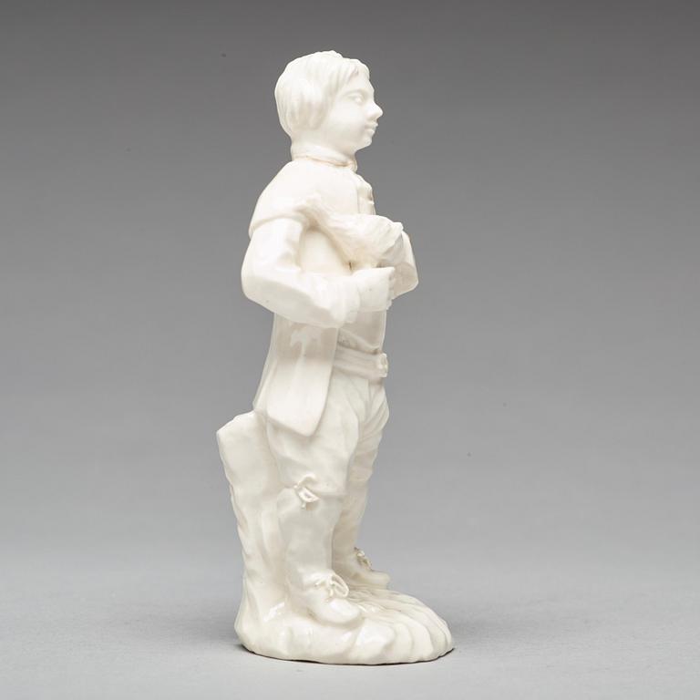 A Swedish Marieberg soft paste figure of a man with a bird, 18th Century.