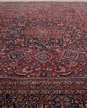 A CARPET,  a semi-antique Mashad, ca 544,5 x 356 cm, signed "Work by Makhmalbaf".