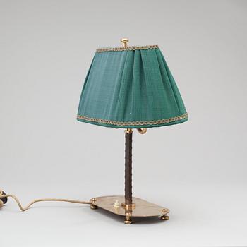 A Josef Frank brass and brown leather table lamp, model nr 2388, Svenskt Tenn 1940-50's.