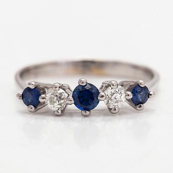 An 18K white gold ring, diamonds totalling approx. 0.20 ct and sapphires.