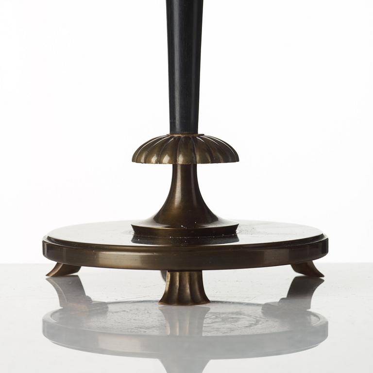 A 1920's patinated metal, lacquered wood, etched och cut glass table lamp, unknown designer, 1920's.