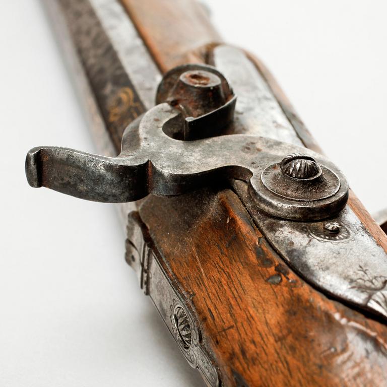 A pair of percussion guns, around the mid 19th century.