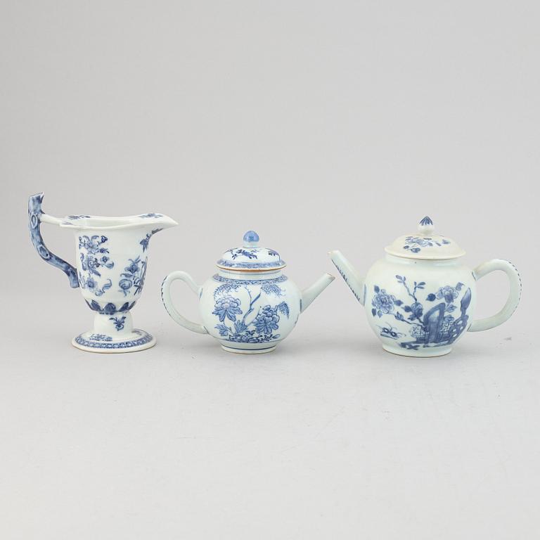 Two blue and white tea pots with cover and a milk jug, Qing dynasty, Qianlong (1736-95).