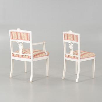 Two gustavian style armchairs and three chairs, first half of the 20th century.