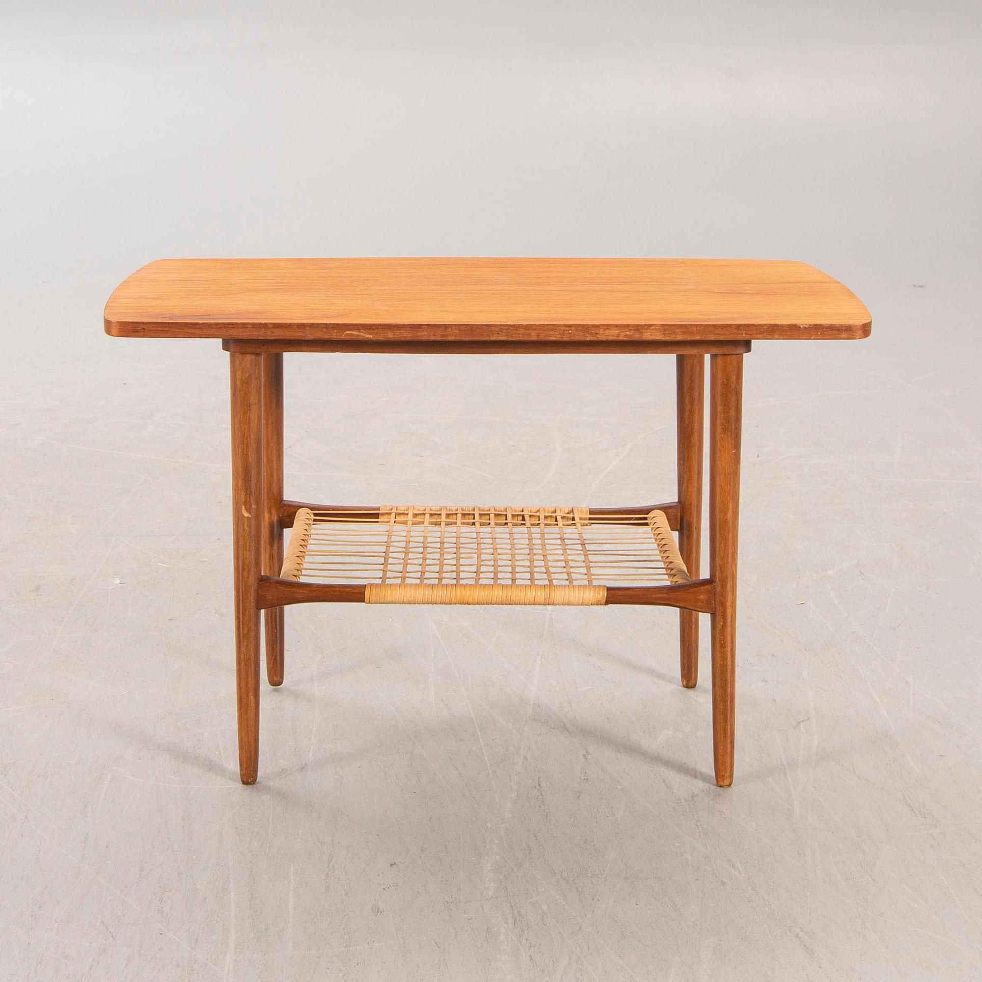 A teak and rattan 1960s coffee table.