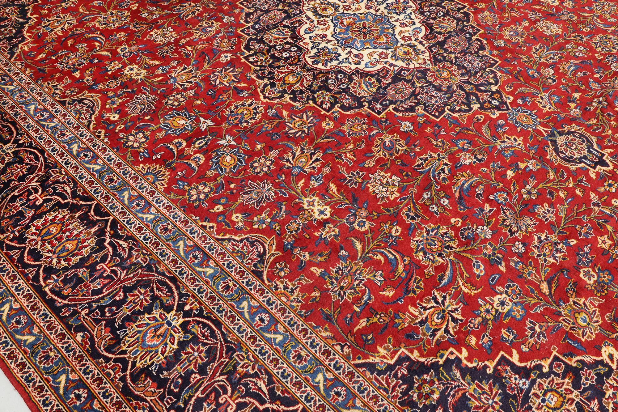 A signed Keshan carpet, approx. 470 x 355 cm.