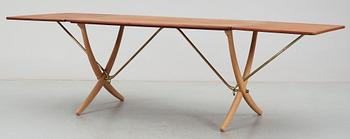 A Hans J Wegner teak and beech dinner table by Andreas Tuck, Denmark.