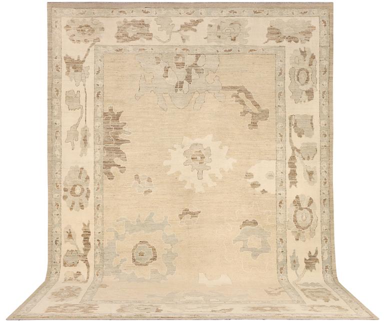 An Ushak design carpet, c. 442 x 317 cm.
