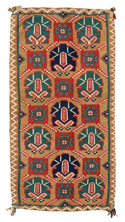 A CARRIAGE CUSHION, "Palmetter och blommor", double interlocked tapestry, ca 105 x 54,5 cm, Scania, Sweden,