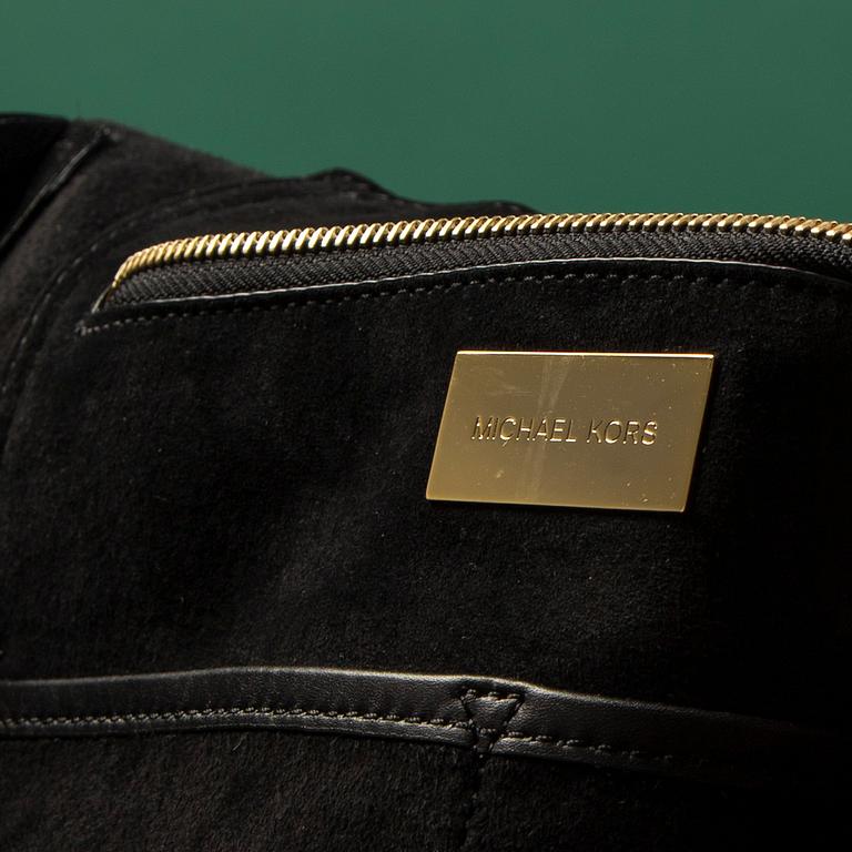 A hand bag by Michel Kors.
