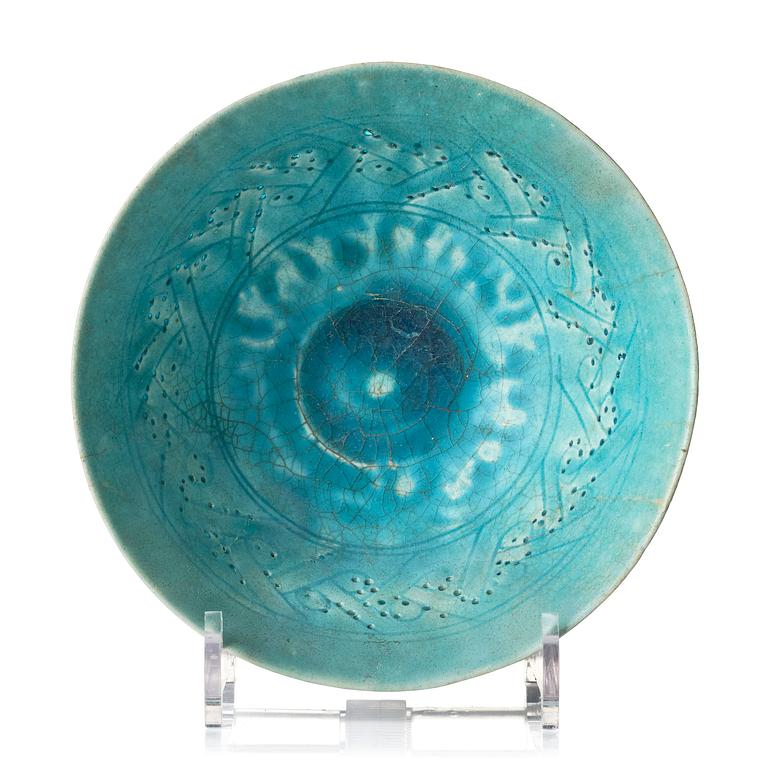 A Kashan Turquoise glazed conical pottery bowl, central Persia, 13th century.