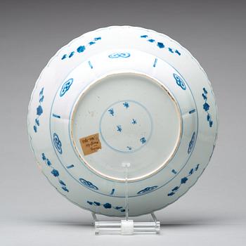 A large blue and white deep dish, Qing dynasty, with Kangxi six character mark and period (1662-1722).
