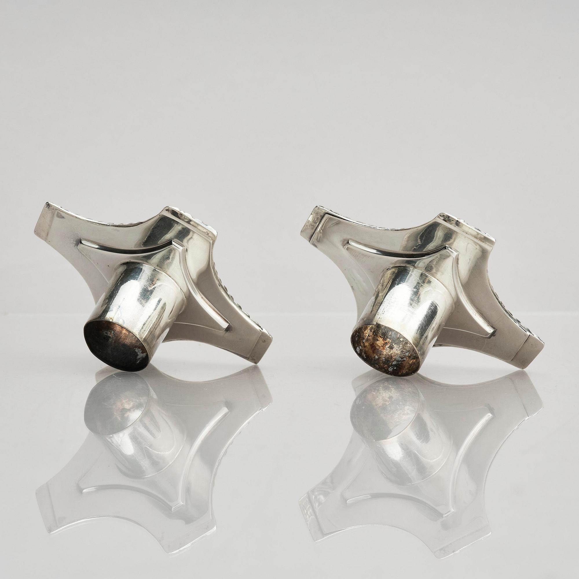 A pair of 18th century silver candlesticks, marks of Ebenezer Coker, London , possibly 1765.