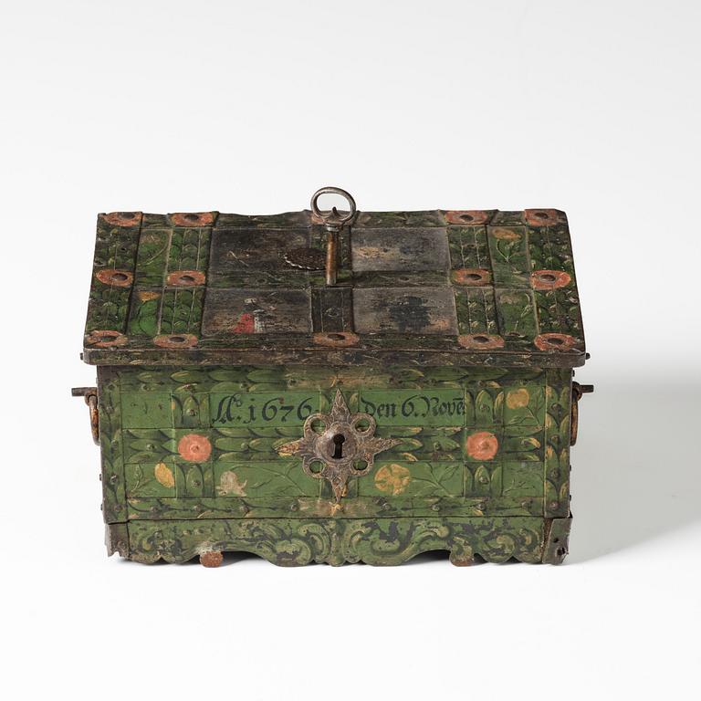 A Baroque South German engraved and polychrome-painted iron and steel strongbox, later part of the 17th century.