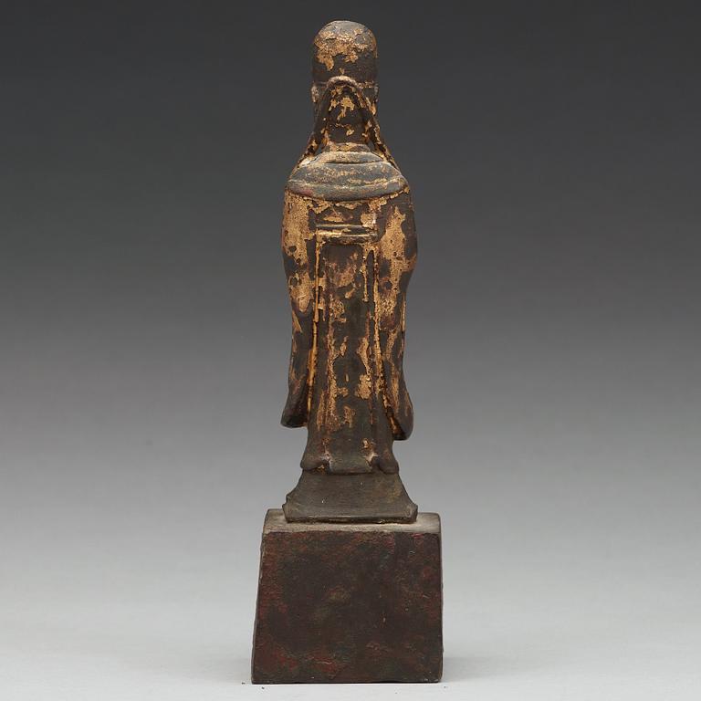 A copper alloy figure of a daoist dignitary, late Ming dynasty (1368-1644).