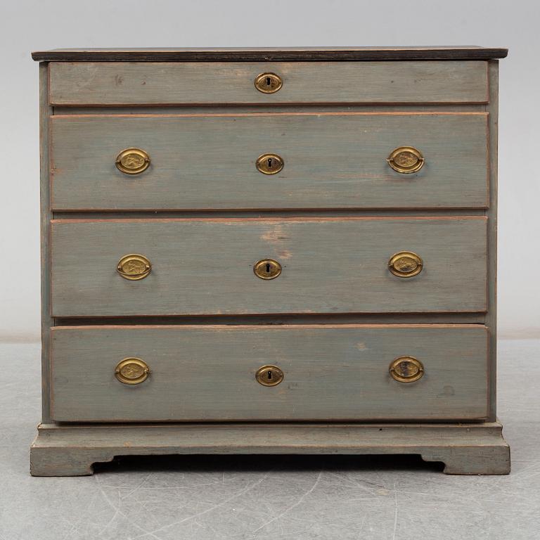 a chest of drawers from the first half of the 19th century.