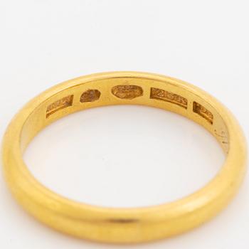 23K gold ring.