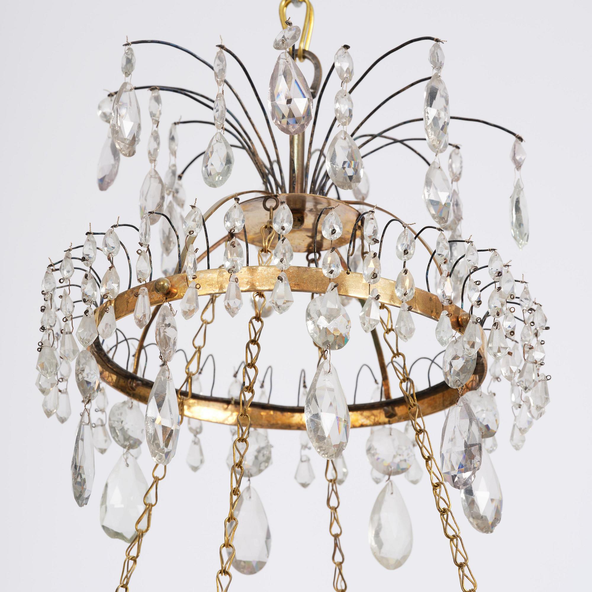 A late Gustavian five-light gilt brass and cut glass chandelier, Stockholm, late 18th century.