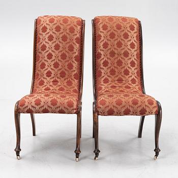 A pair av easy chairs, 19th Century.