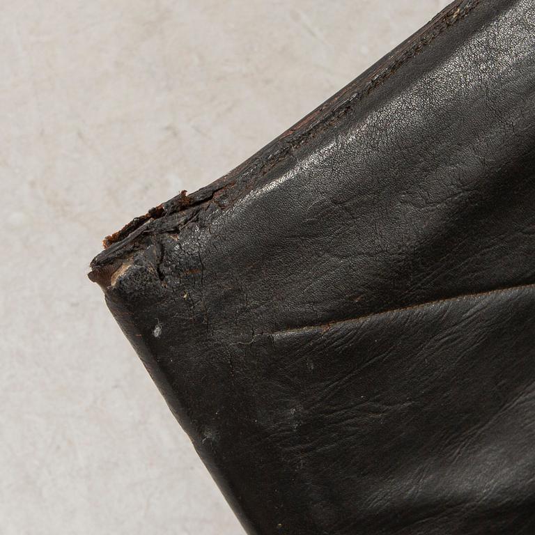 A pair of Poul Kjaerholm metal and leather PK22 easy chairs from Kold Christensen Denmark.