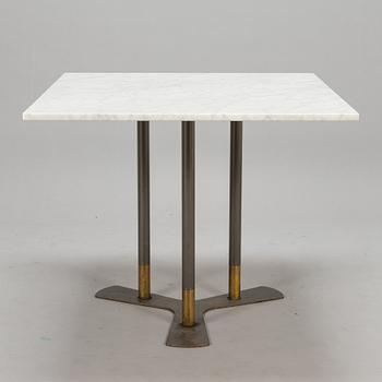 A marble top table, 21th century.