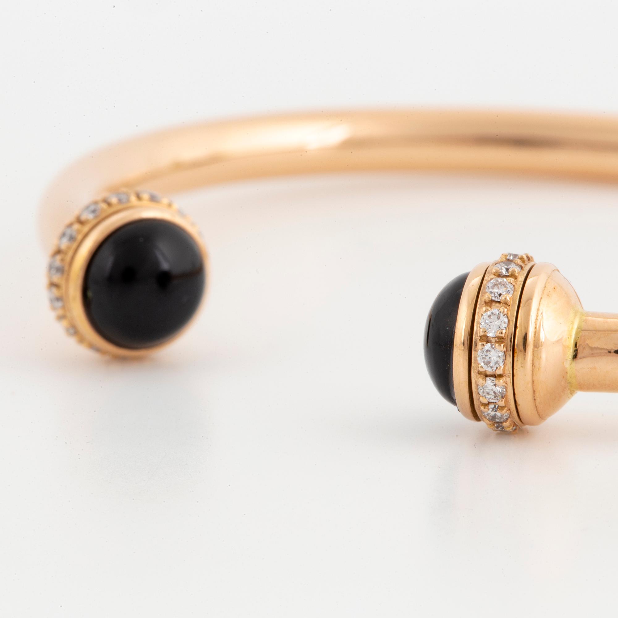 Piaget 18K rose gold, brilliant-cut diamonds and onyx cabochons.
