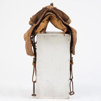 A leather saddle of Caucasian type, dated 1821.