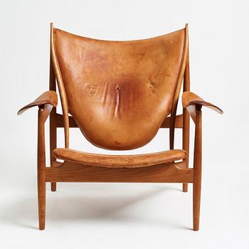 Finn Juhl, a teak and natural brown leather "Chieftain Chair" by Niels Vodder, 1950-60's.