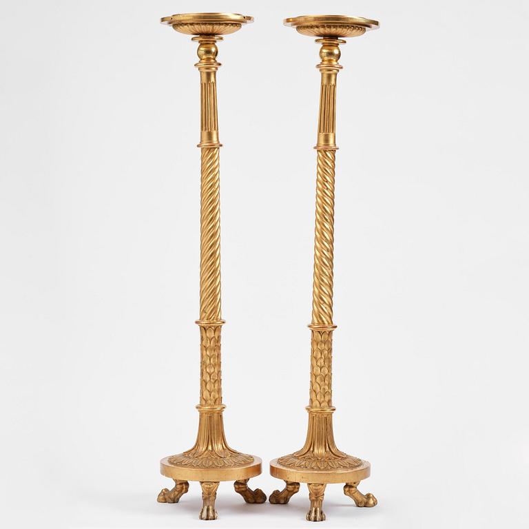 A pair of late Gustavian giltwood torchères by J. Frisk (master in Stockholm 1805-24).