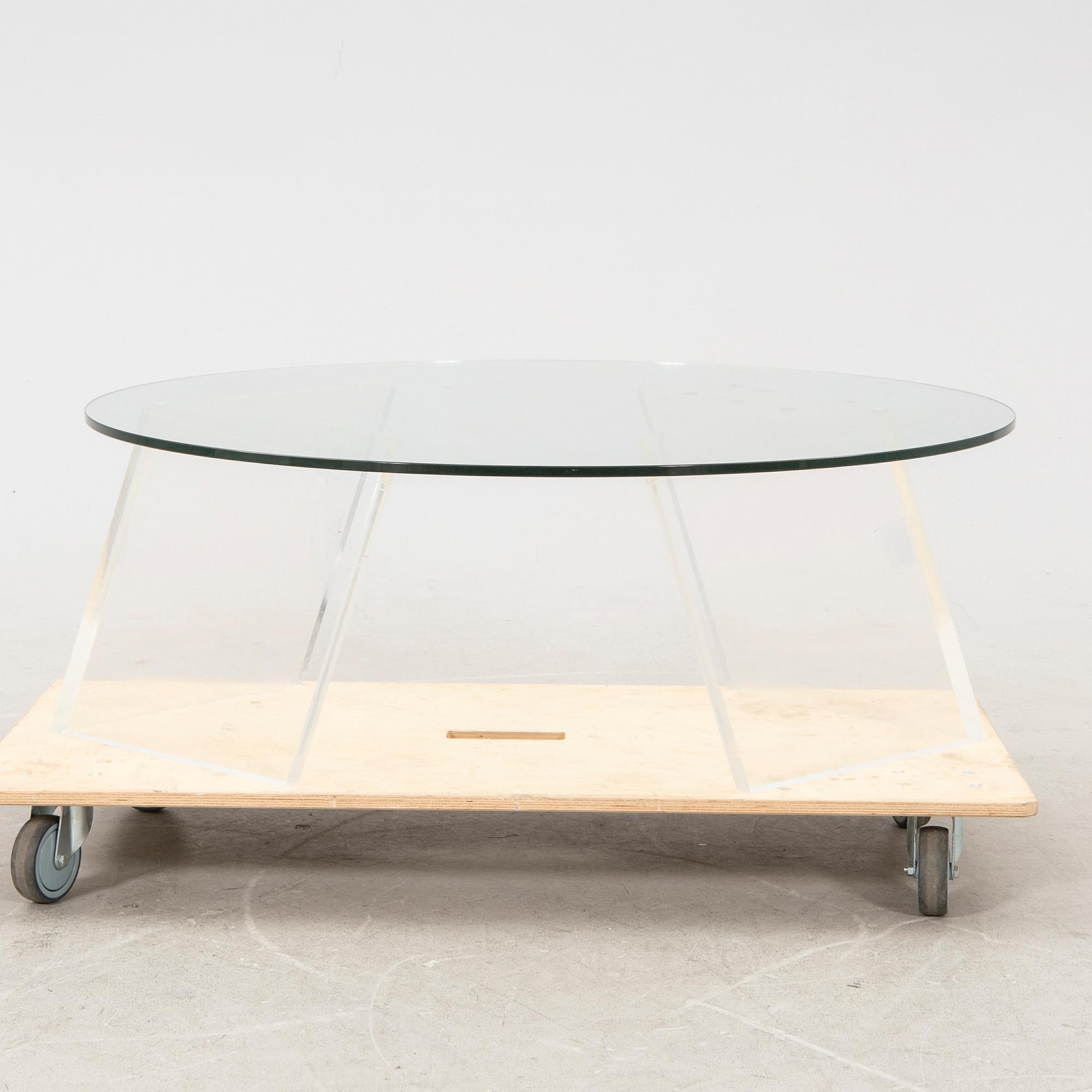 A late 20th century glass and plexi coffee table.