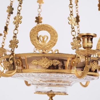 An Empire cut glass and gilded bronze six-light hanging lamp in the manner of Alexandre Guérin.