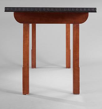 A Hjalmar Jackson ebony and pear wood desk / library table, Stockholm 1934, possibly designed by Oscar Nilsson.