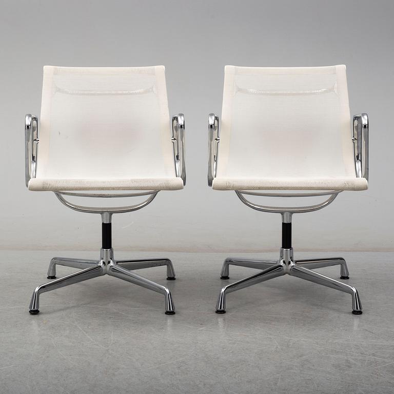 A pair of EA 107 chairs by Charles & Ray Eames, Vitra.