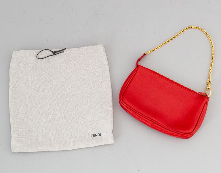 FENDI, a red hand bag.