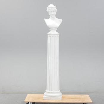 A plaster bust and pedestal.