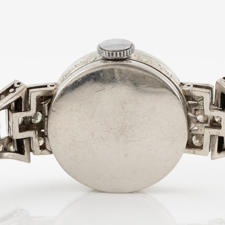 Damarmbandsur, platina med åttkantslipade diamanter, med textilrem.