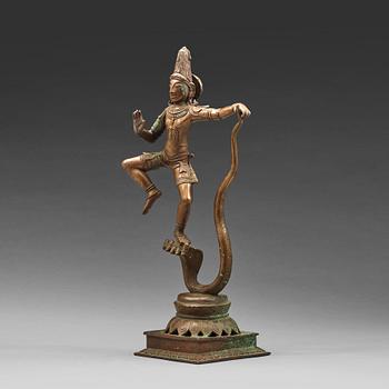 A bronze scupture of Krishna who has konkured the five headed serpant, India, early 20th Century.