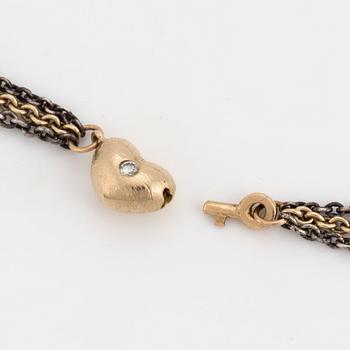 A necklace by Ole Lynggaard, the clasp decorated with a diamond.